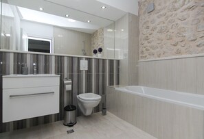 Bathtub, hair dryer, towels, soap