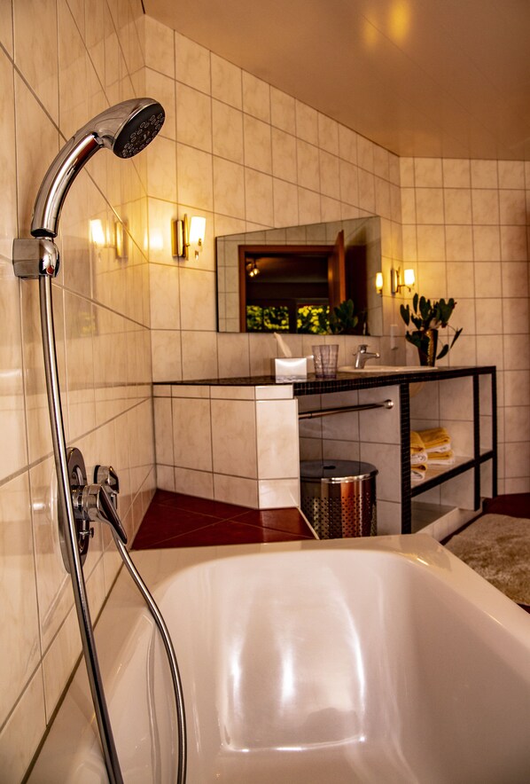 Bathtub, hair dryer, towels, soap