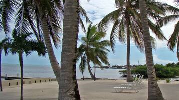 On the beach, sun loungers, beach towels