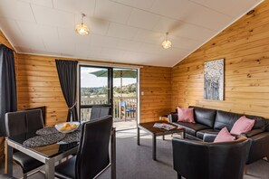 2 Bedroom Cottage | Living area | Flat-screen TV, DVD player - Sunseeker Cottages Motel (Haruru)