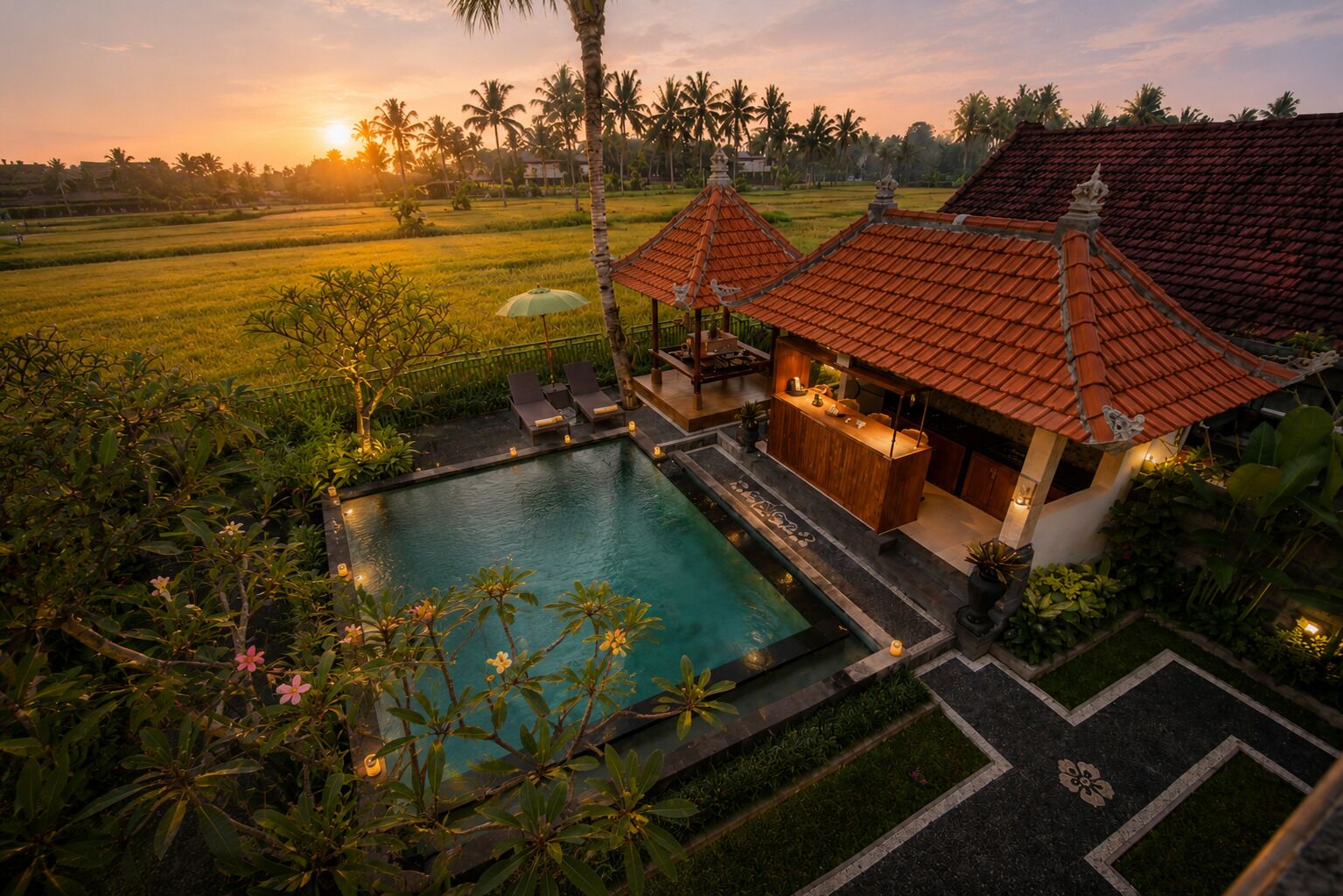 A pool surrounded by lush greenery and traditional architecture.
