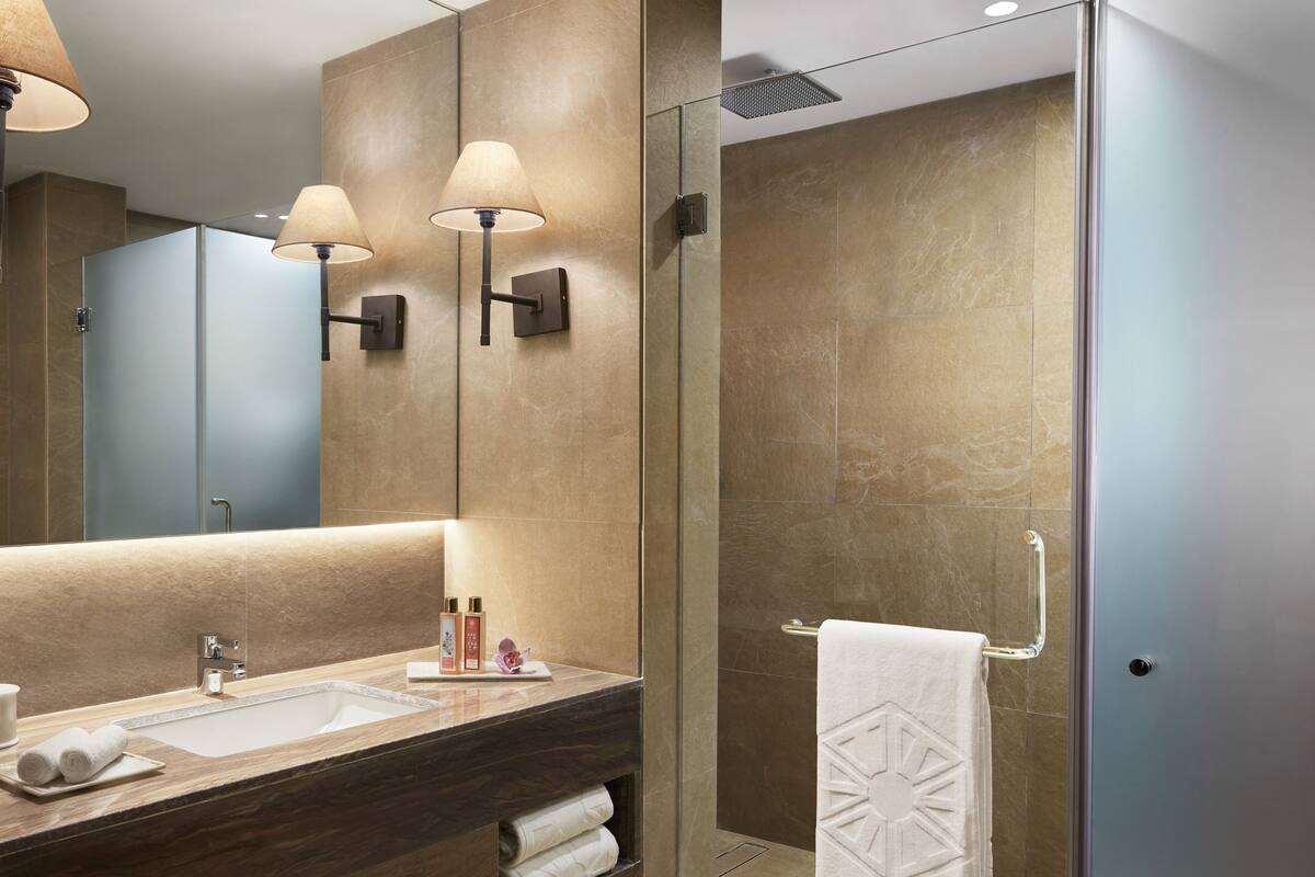 eco-friendly toiletries, hair dryer, bathrobes, slippers