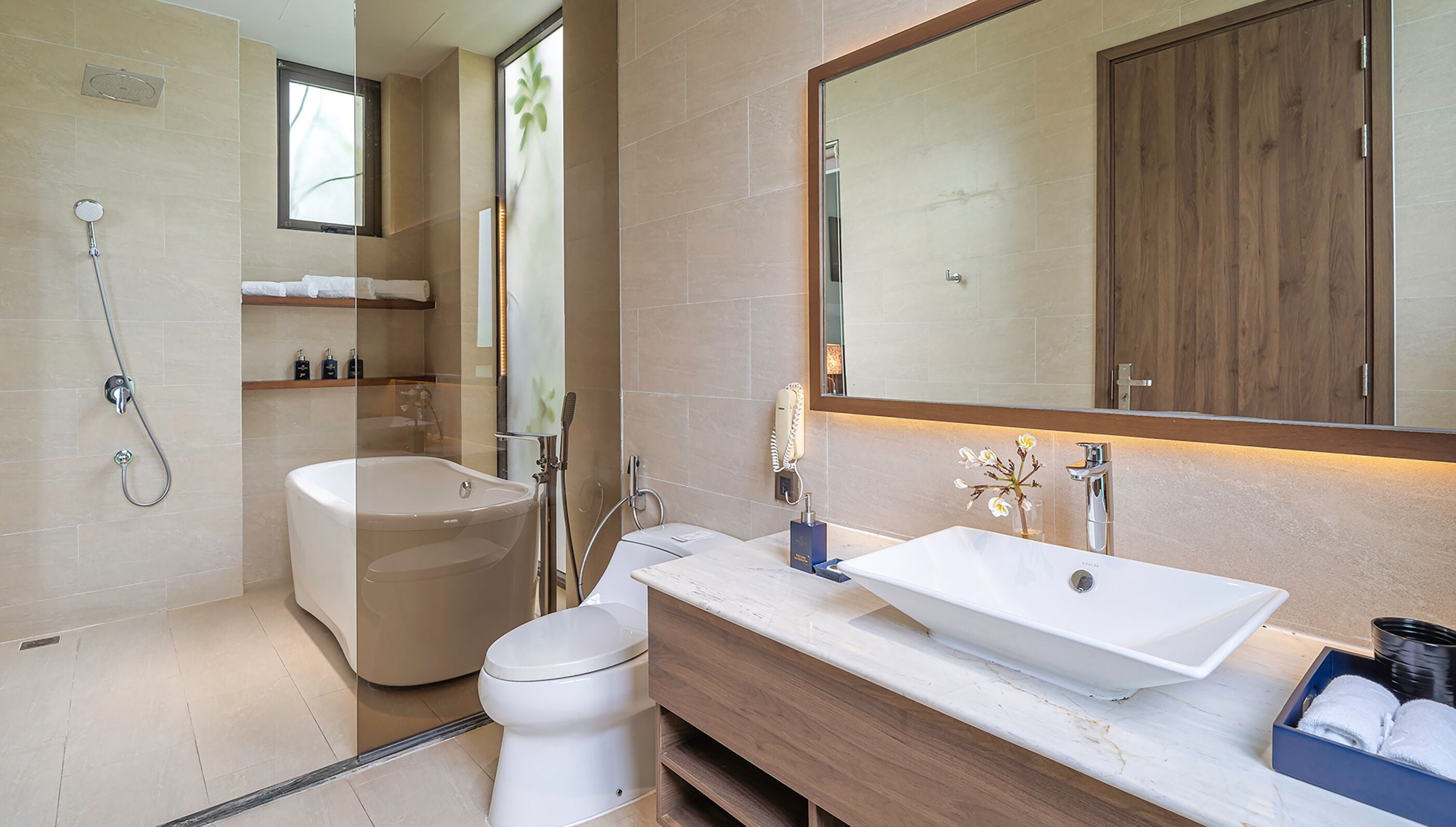 designer toiletries, hair dryer, bathrobes, slippers