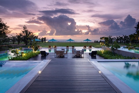 3 outdoor pools, open 6:00 AM to 10:00 PM, pool umbrellas, sun loungers