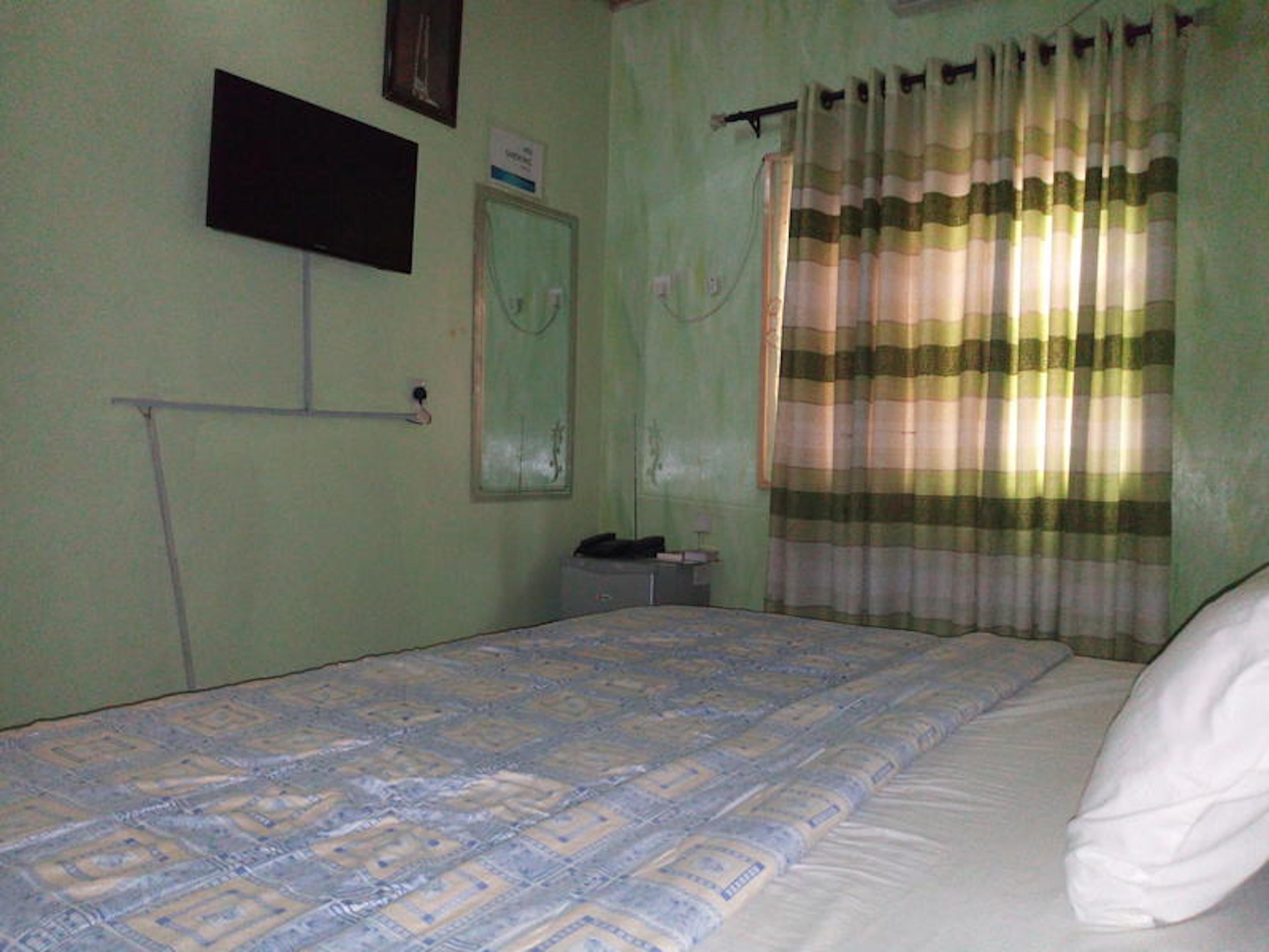 Desk, blackout drapes, bed sheets