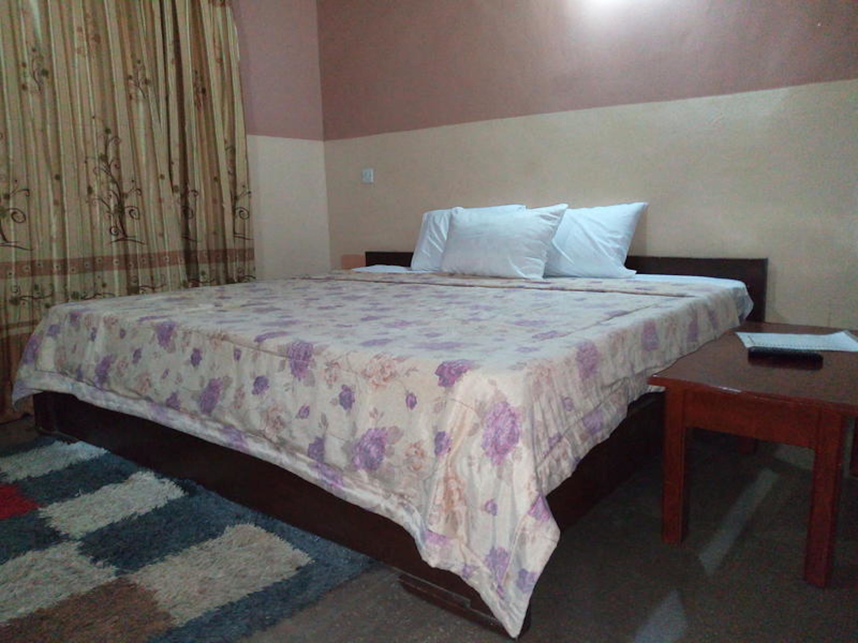 Desk, blackout drapes, bed sheets