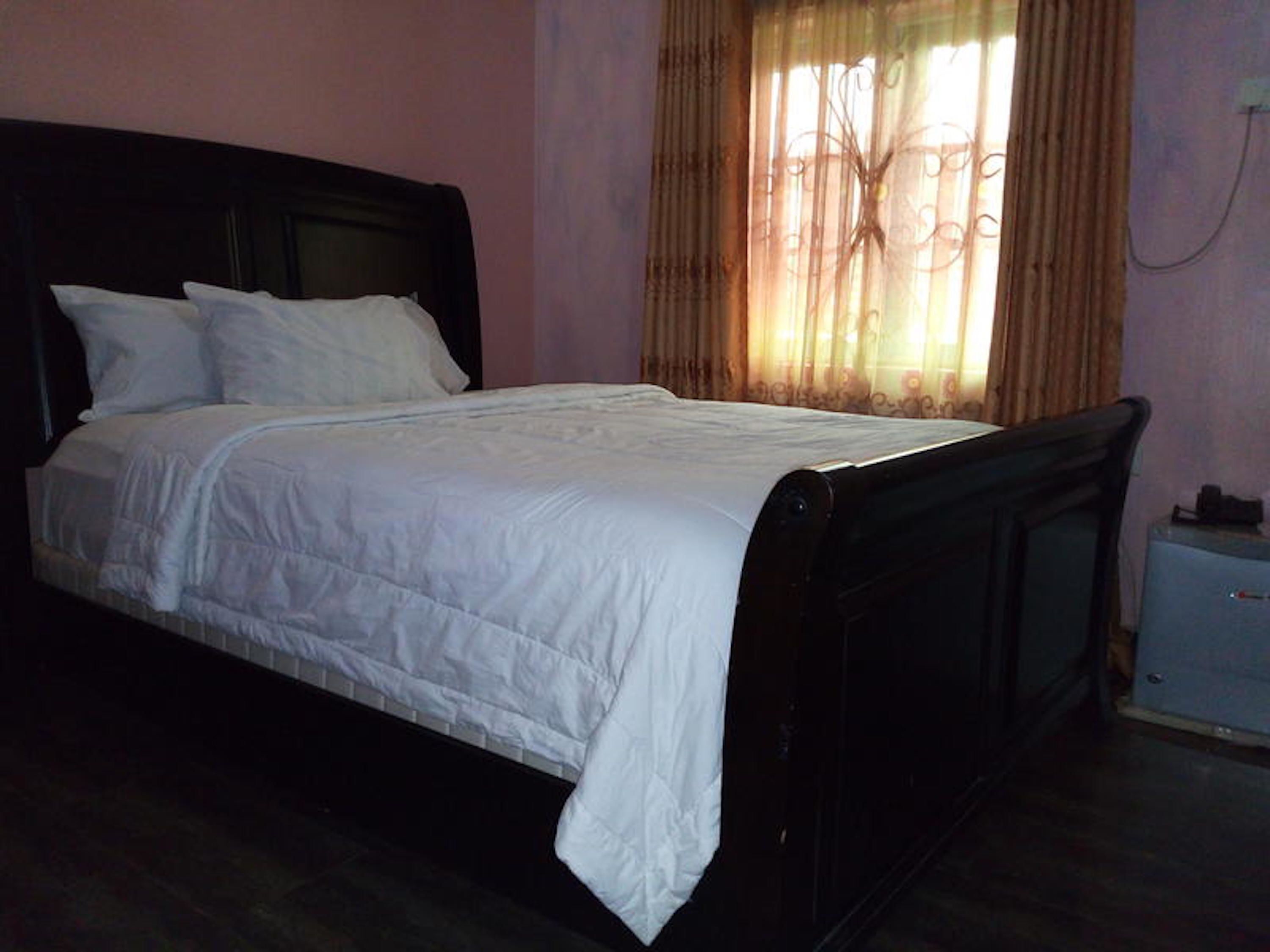 Desk, blackout drapes, bed sheets