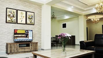 Luxury Apartment, City View | Living room | Flat-screen TV