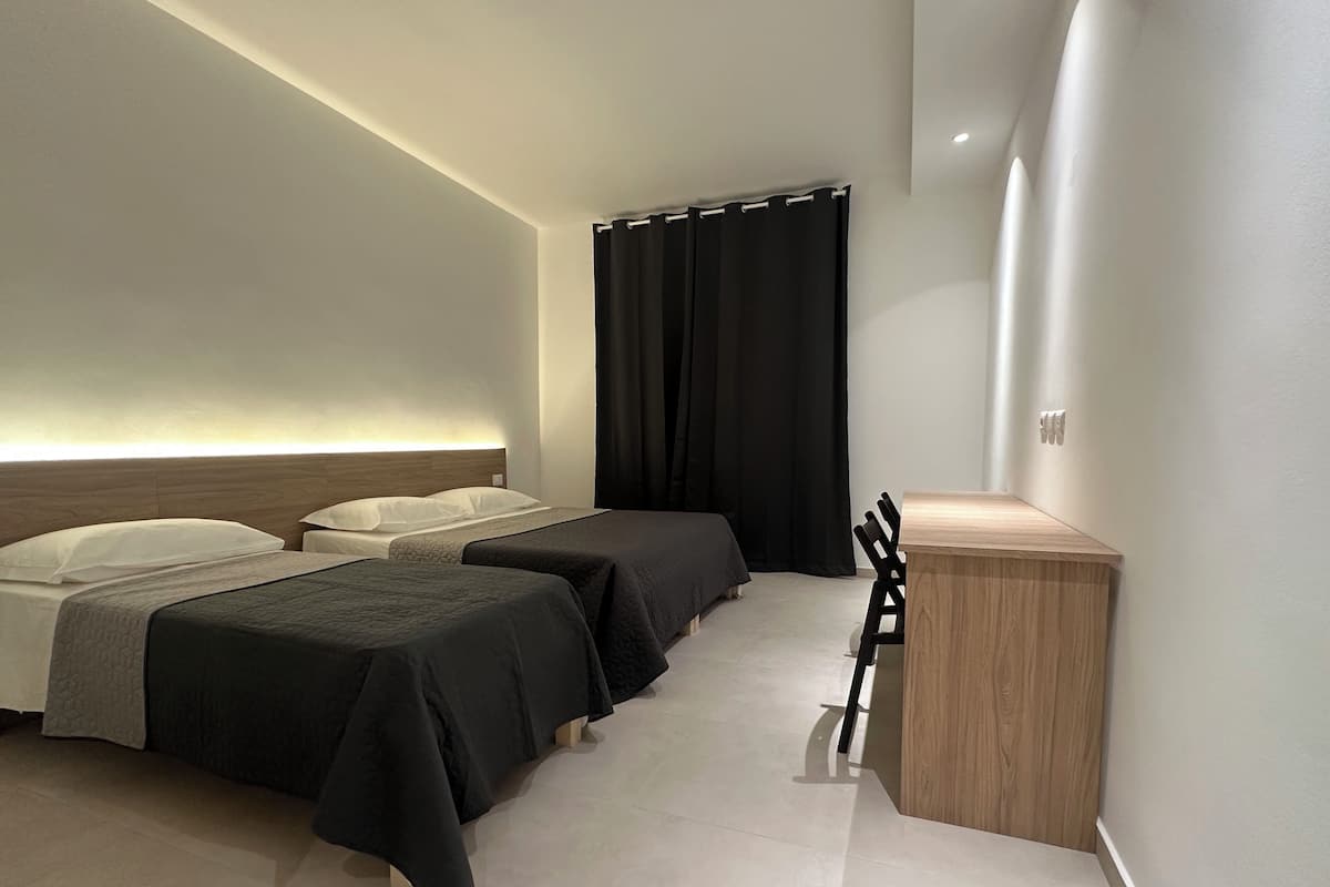 Desk, blackout drapes, WiFi (free), bed sheets
