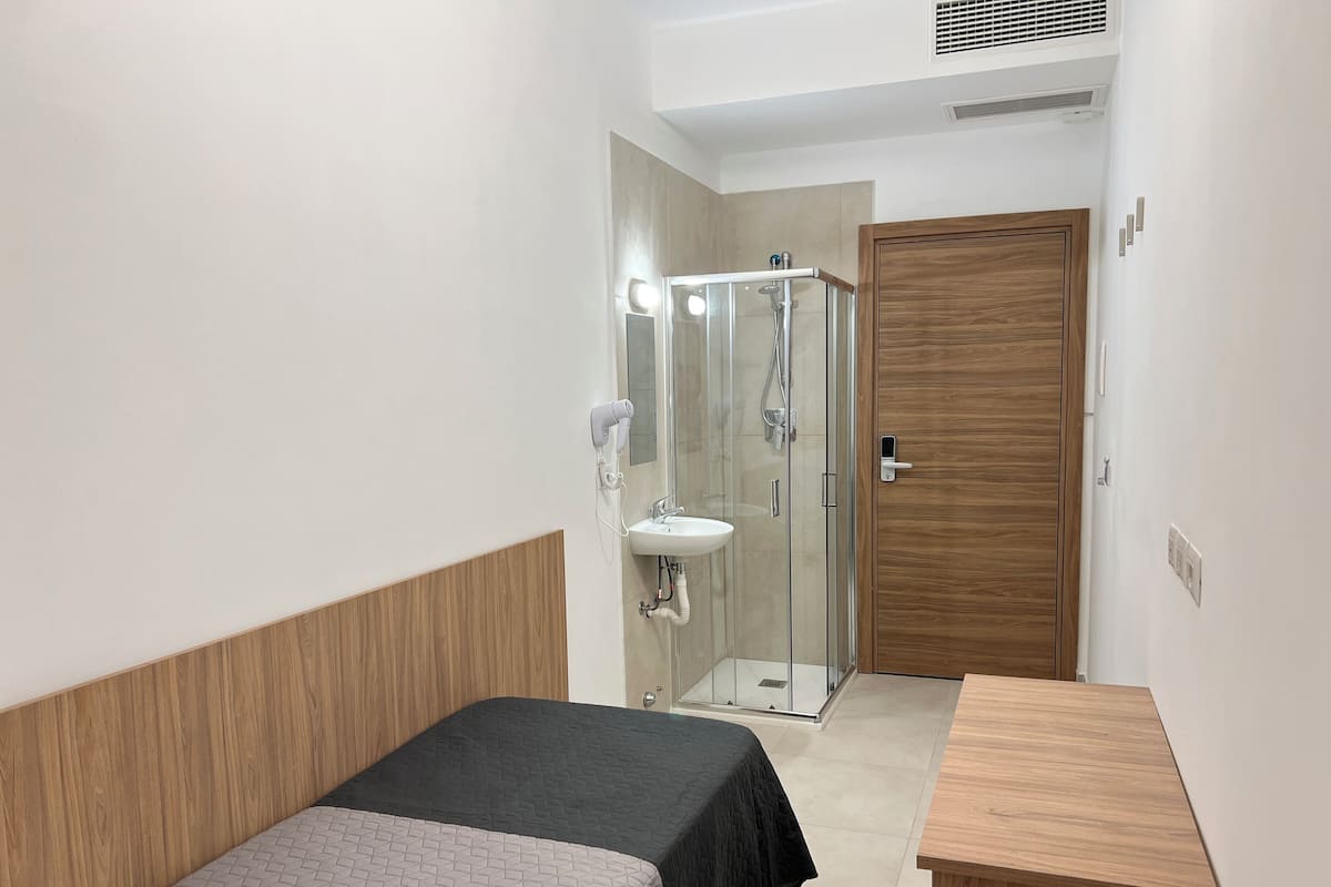 Desk, blackout drapes, WiFi (free), bed sheets