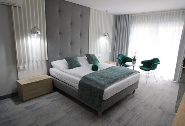 Premium bedding, blackout drapes, iron/ironing board, free WiFi