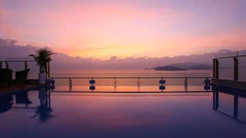 Outdoor pool, open 6:00 AM to 9:00 PM, pool loungers