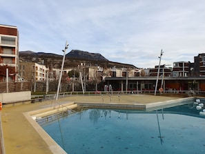 Seasonal outdoor pool, open 10:00 AM to 8:00 PM, pool umbrellas