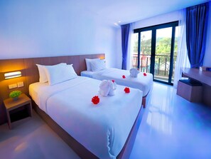 Habitación Deluxe | Ropa de cama de alta calidad, minibar, caja fuerte y escritorio