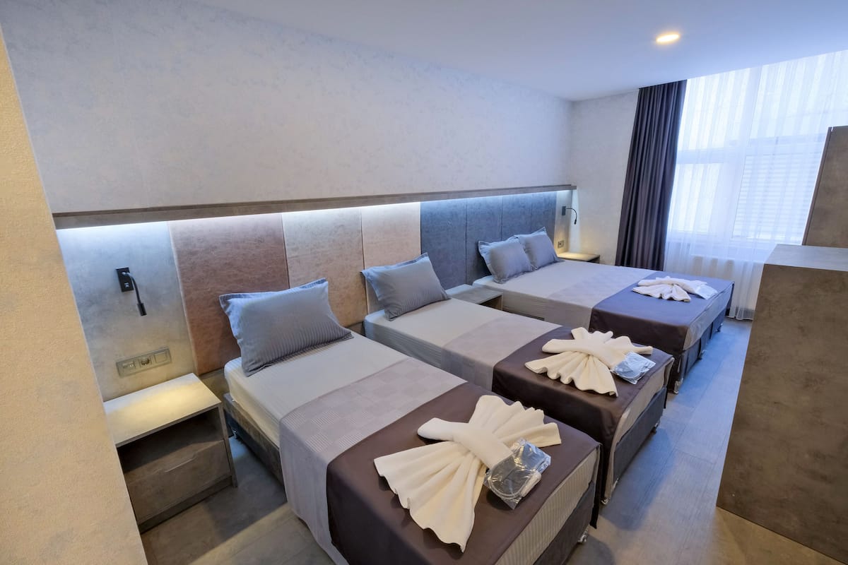 Standard Quadruple Room, Multiple Beds, Non Smoking | Egyptian cotton sheets, premium bedding, minibar, in-room safe