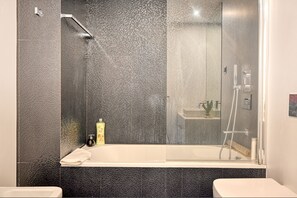 Bathtub, hair dryer, towels