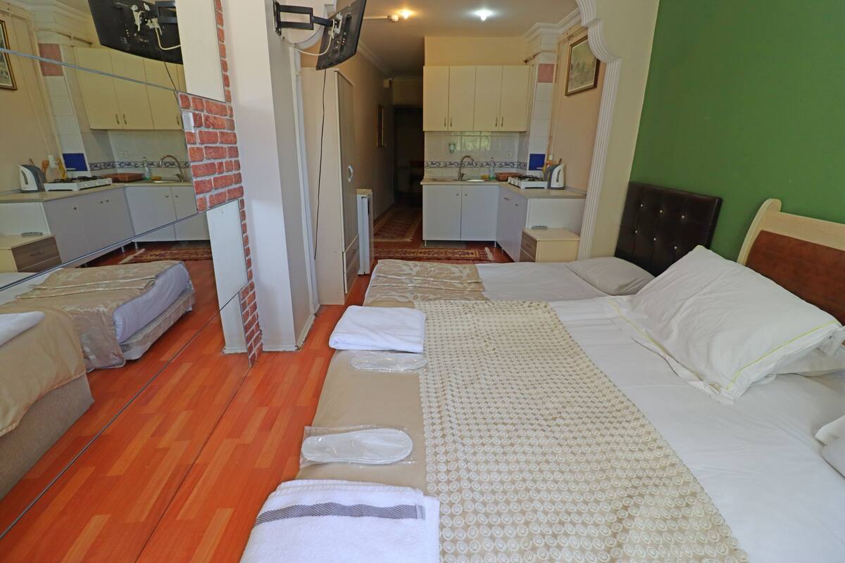 Apartment, Ground Floor | Minibar, iron/ironing board (on request), WiFi (free), bed sheets
