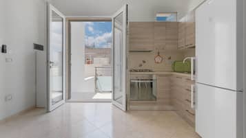 Comfort Apartment, 2 Bedrooms (1065) | Private kitchen | Full-sized fridge, oven, stovetop, cookware/dishes/utensils