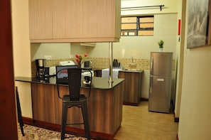 Apartment, Non Smoking | Private kitchen | Fridge, microwave, oven, stovetop - Sherry Homes - Fahari I (Nairobi)