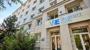 A building labeled "University Hotel" with a modern facade, large windows, and a visible entrance. - University Hotel (Prague)