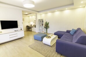Family Apartment, 2 Bedrooms | Living area | Flat-screen TV
