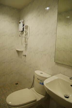 A bathroom with a toilet, bidet, and sink. - The 92 residence (Bangkok)
