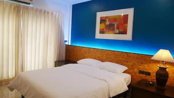 Hypo-allergenic bedding, desk, laptop workspace, blackout curtains