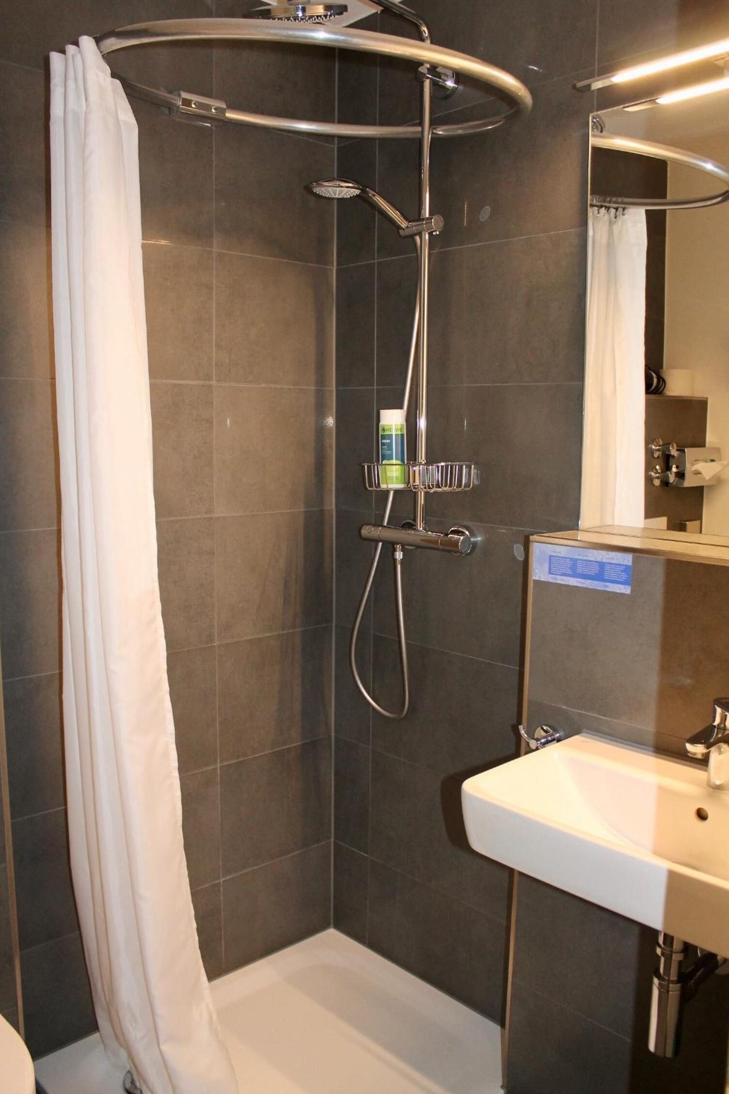 Shower, rainfall showerhead, hair dryer, towels
