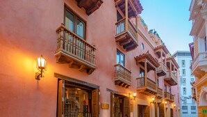 A row of traditional buildings with wooden balconies and wrought iron railings. - Hotel Santa Catalina By OxoHotel (Cartagena)