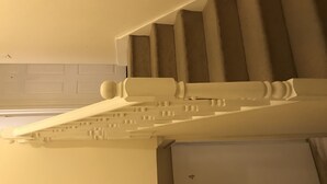 A staircase with a white balustrade and carpeted steps. - Rooms at 5 Hammersmith Road - Hostel (London)