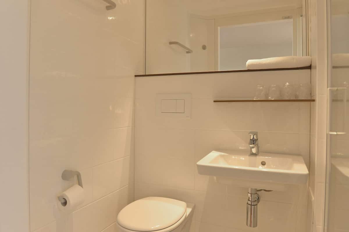 shower, eco-friendly toiletries, towels