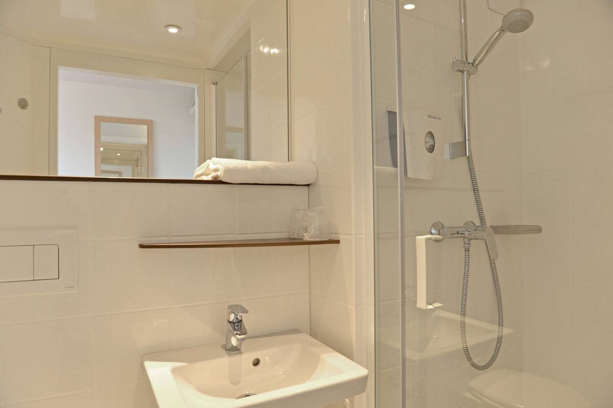 shower, eco-friendly toiletries, towels