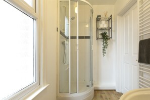 Shower, hair dryer, towels, toilet paper
