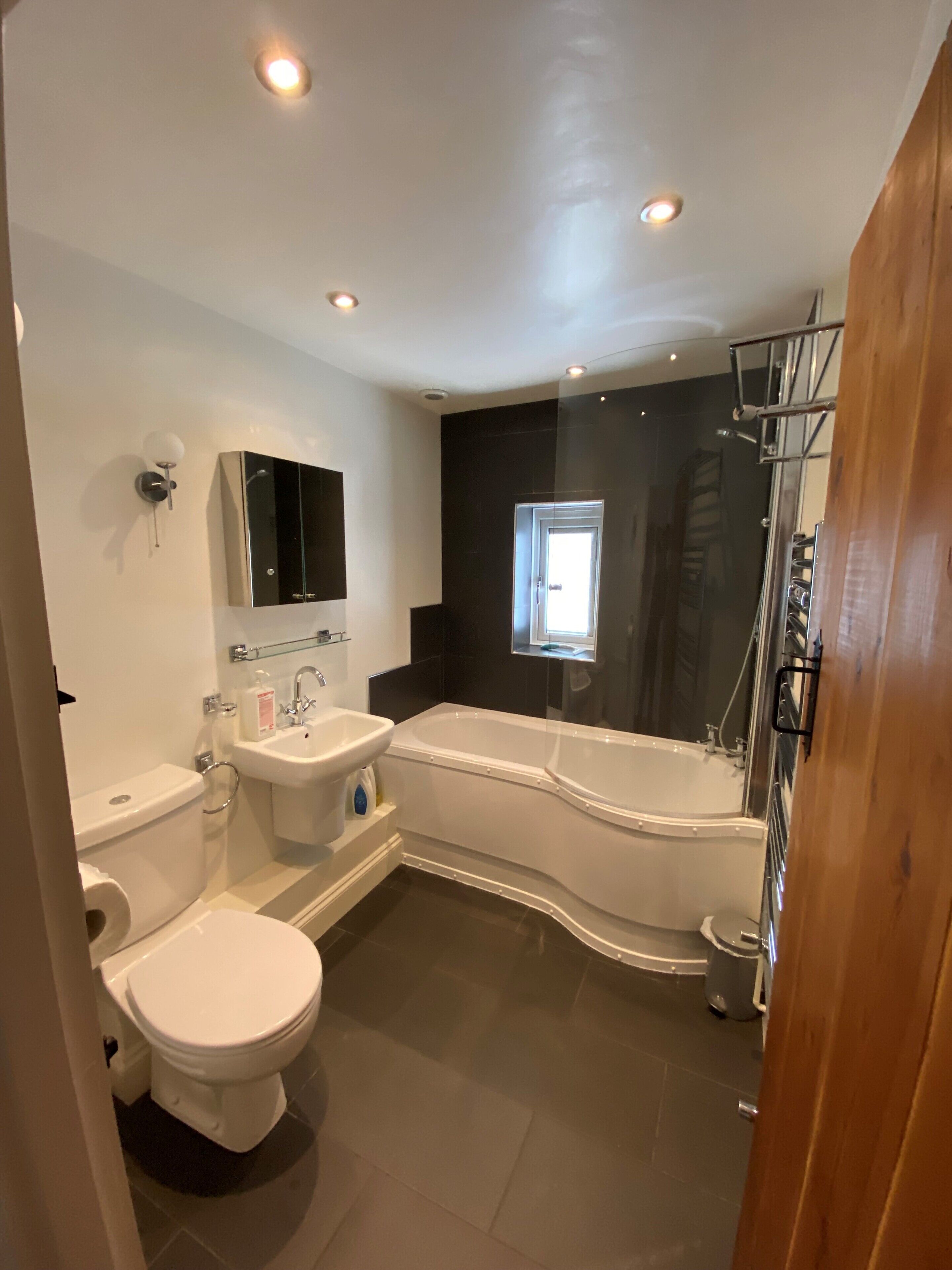 Combined shower/tub, hair dryer, towels, soap