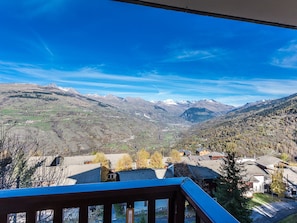 A mountain landscape with a village in the valley.