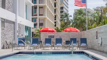 Outdoor pool, open 9:00 AM to 5:00 PM, pool umbrellas, pool loungers