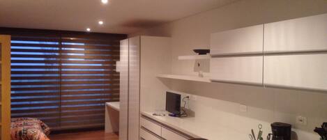 Fridge, microwave, cookware/dishes/utensils
