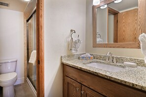 Combined shower/tub, hair dryer, towels, soap