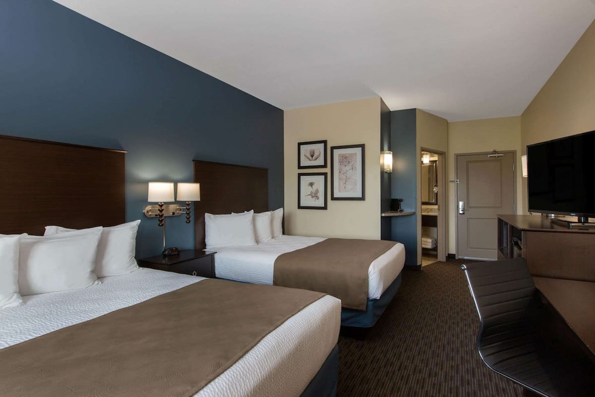 Pillow-top beds, desk, laptop workspace, blackout curtains