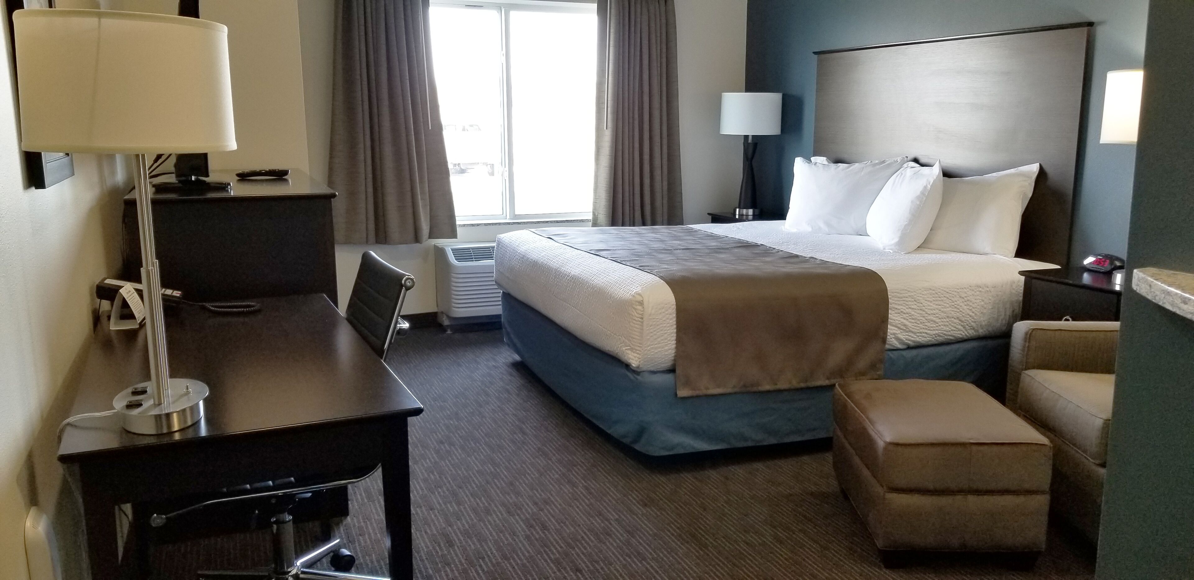 pillow-top beds, desk, laptop workspace, blackout curtains