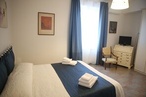 Relax in a cozy space with a comfortable bed, a chair, and a dresser for your essentials.