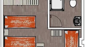 A hotel room layout with a bed, a desk, a chair, a toilet, and a shower area. - Minx - Cityhotels (Aachen)