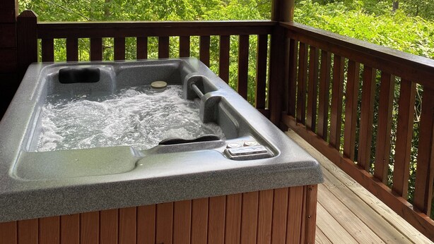 A hot tub on a wooden deck with a view of lush green trees. - Mtn.View from Hottub, A+ Location 2 Mi to PF.Pkwy,Not up Mtn,Private,SUPERCLEAN (Sevierville)