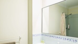 Shower, hair dryer, towels, toilet paper