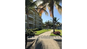 Stunning residential building with a symmetrical facade and beautifully manicured grounds.