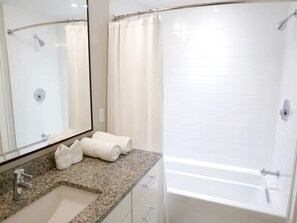Bathtub, hair dryer, towels