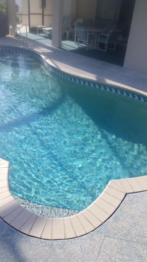 Outdoor pool, a heated pool, pool loungers
