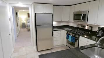 Fridge, microwave, coffee/tea maker, cookware/dishes/utensils