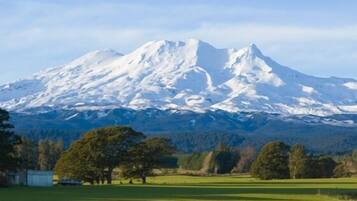 A snow-covered mountain with a clear sky.