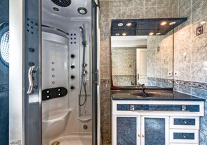 Shower, hair dryer, towels, toilet paper